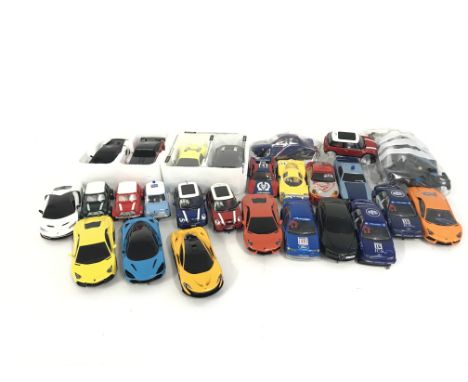 A box containing a collection of used Scalextric cars and accessories. No reserve.