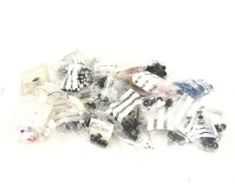 A box containing a large quantity of spare parts for Scalextric cars. No reserve.