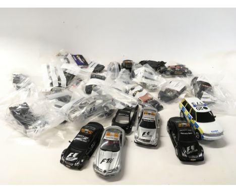 A collection of Scalextric cars..spare parts and accessories. No reserve