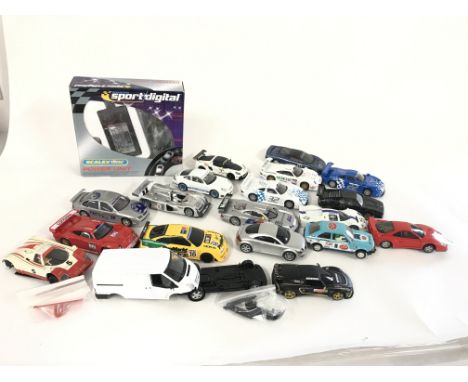 A box containing a quantity of Scalextric cars. Also to include some spares and accessories. No reserve.
