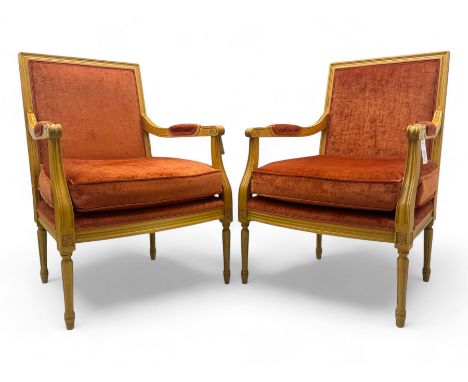 Pair of mid-20th century beechwood fauteuil armchairs, upholstered backrest and seat in terracotta velvet fabric, padded armr