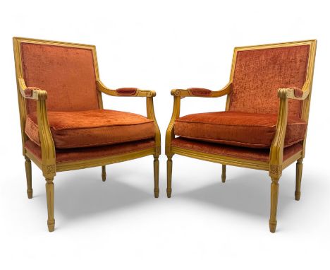 Pair of mid-20th century beechwood fauteuil armchairs, upholstered backrest and seat in terracotta velvet fabric, padded armr