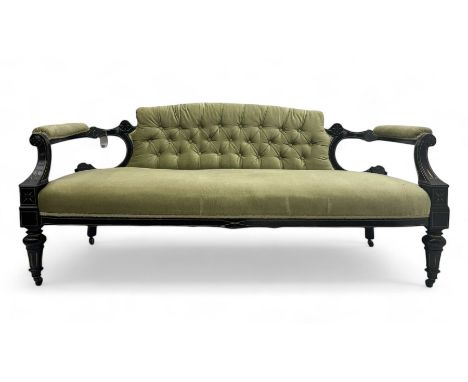 Early 20th century ebonised and parcel-gilt sofa, upholstered in olive green fabric with button-tufted backrest and cushioned