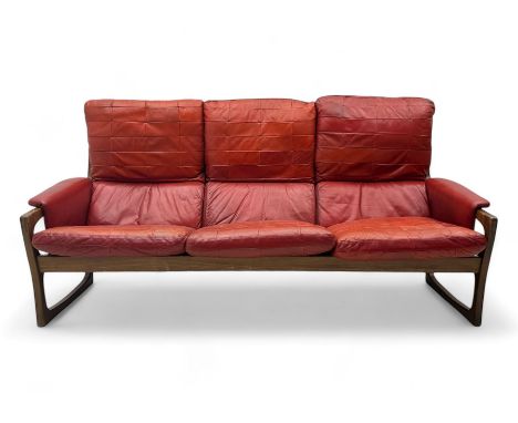 Folke Ohlsson for Gimson & Slater - mid-20th century Danish teak-framed sofa, red leather upholstery with patchwork design, r
