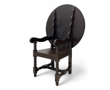 Late 19th century oak monk's bench, circular hinged top with lozenge carving to one side and scrolling foliage band to the ot