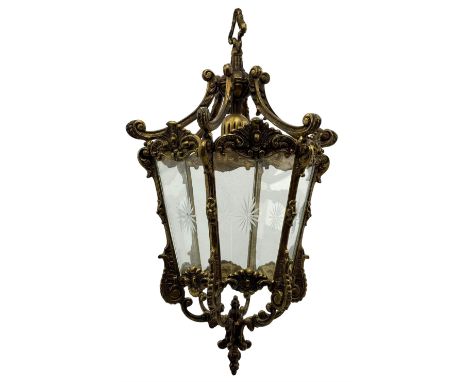French design gilt bronze and glass lantern, of hexagonal form with foliate and scroll decoration, six star etched glass pane