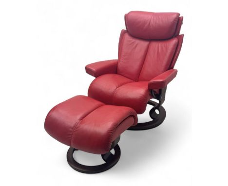 Erkonnes Stressless - 'Magic' reclining armchair and matching stool upholstered in red leather Dimensions: Height:&nbsp;102cm