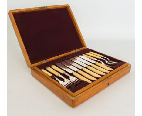 A bone-handled silver-plated set of 12 fish knives and forks - in the original honey oak fitted case; together with a 12-plac