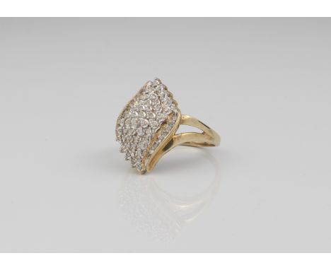 A 9ct gold and diamond cluster ring - London hallmarked, the twist, foliate shaped setting with sixty-one small single cut di