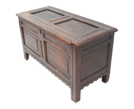 An early 18th century joined oak two-panel coffer - the moulded, two-panel lid on the original ring hinges, later iron lock, 