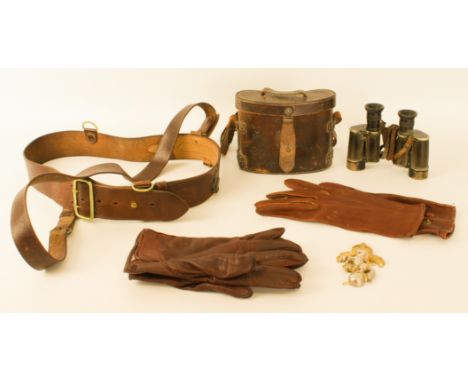 A pair of WWI leather and black lacquered brass binoculars - by Dollond of London, 'Prismatic x6', broad arrow mark, with str