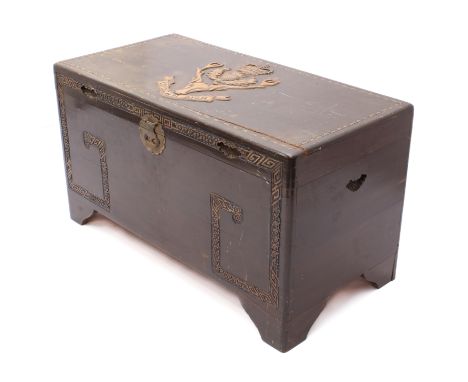 An early 20th century stained camphor wood trunk - the lid relief carved with the regimental crest of the Seaforth Highlander
