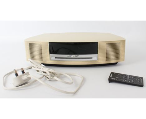 A Bose Wave Music System CD radio stereo music system - model no. AWRCC6, with mains lead and remote control, tested and in f