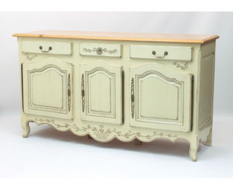 A French style painted and pine buffet - to match the table and chairs (lot 412), the moulded top over three drawers (one fit