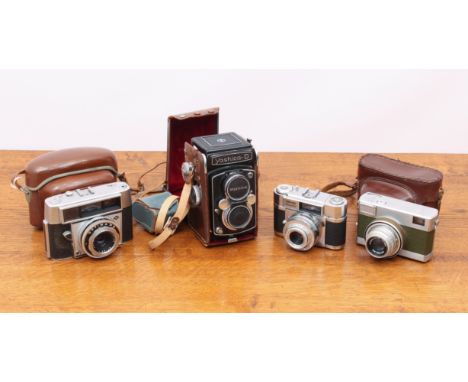 A collection of 1940s-60s cameras - mostly 35mm, including an AGFA Optima III S; a Yashica D twin-lens reflex camera; two AGF