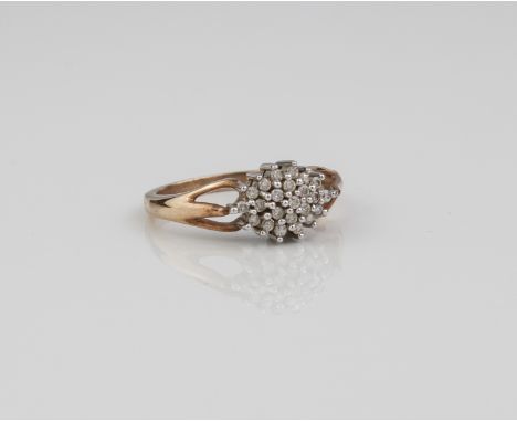 A 9ct gold and diamond cluster ring - set with small brilliant cut diamonds in an elliptical cluster,&nbsp; total 0.25ct, ove