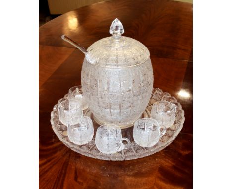 A fine quality Bohemian cut glass punch set - second half 20th century, the covered ovoid punch bowl cut with vertical panels