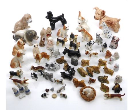 A large collection of miniature pewter, porcelain, bone china and pottery dogs - including examples by Sylvac and Wade, a pew