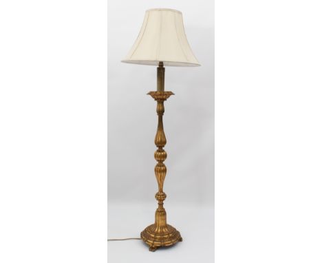 A giltwood standard lamp, mid-20th century - the fluted baluster column to a lappet moulded circular base with three scroll f