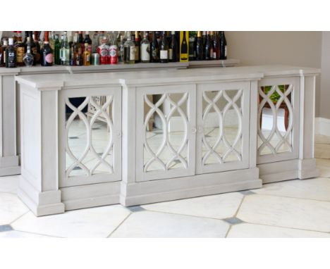 A French 19th century style breakfront bar - painted in light distressed grey, with four mirrored doors with astragal glazing