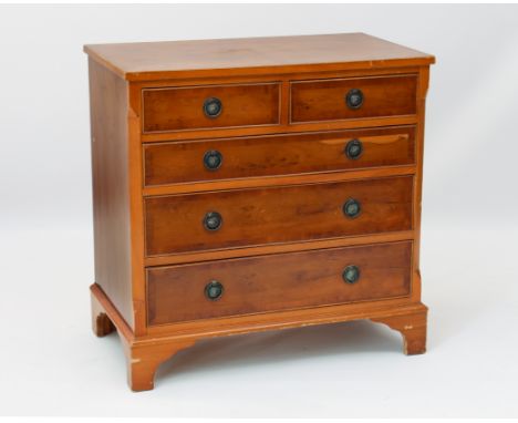 A reproduction Georgian style yew veneered chest of drawers - of small proportions, the cross-banded top over two short and t
