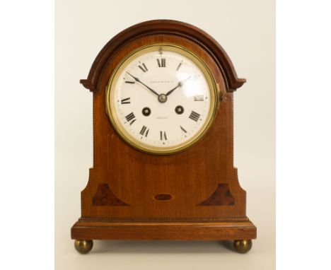 An Edwardian walnut cased mantel clock - the half hour striking, eight day twin train movement by Richard &amp; Co., Paris, n