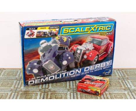 A boxed Scalextric QuickBuild Demolition Derby Metal Alien Vs White Skull set - 1/32 scale, appears to be complete, in good c