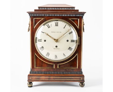A REGENCY MAHOGANY AND BRASS-MOUNTED QUARTER STRIKING CHAMFER TOP BRACKET CLOCKThe chamfer top case with moulded cornice abov
