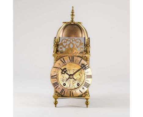 A BRASS LANTERN CLOCKIn the 17th Century style, circa 1950Of usual form, surmounted by a turned finial above the bell, with p