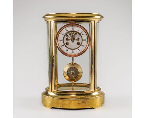 A FRENCH BRASS OVAL FOUR-GLASS MANTEL CLOCKCirca 1890With a stepped top above bevelled glass panels, on a stepped base, the 5