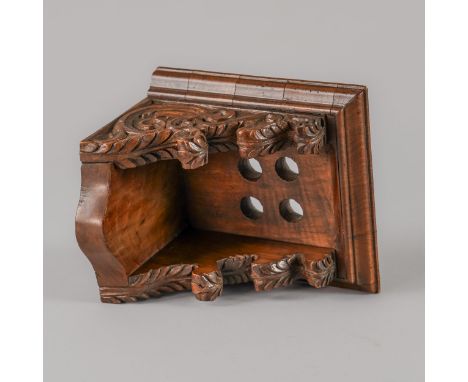 A CARVED WALNUT MINIATURE LANTERN CLOCK BRACKETIn the 17th Century styleWith a moulded edge, supported by two scrolled foliat