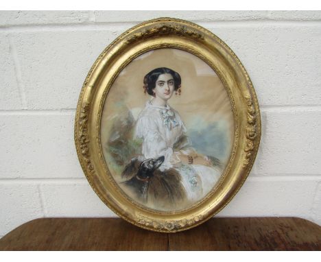 E. LE DESSAIN portrait of a seated lady with a dog, charcoal, watercolour and body colour signed and dated 1856, in a gilt an