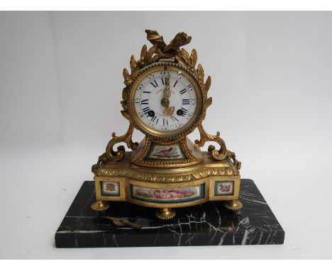 A late 19th Century French Andre Hoffman ceramic and ormolu clock 