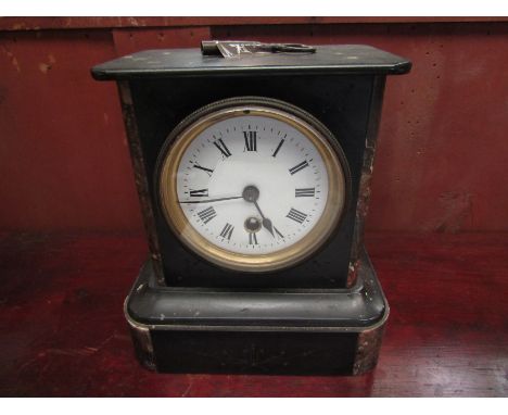 A Victorian slate and marble mantel clock with key and pendulum 