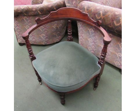 A late Victorian walnut corner chair on ring turned legs and brass castors, 74cm high x 65cm wide