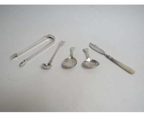 A quantity of silver including caddy spoons, sugar tongs, butter knife 