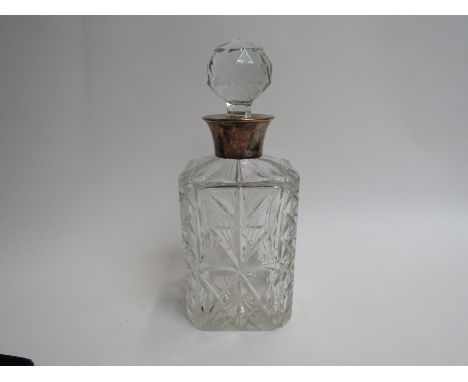 A Charles S Green &amp; Co Ltd crystal glass silver necked decanter with facet finial stopper slight grazing to glass, 25.5cm