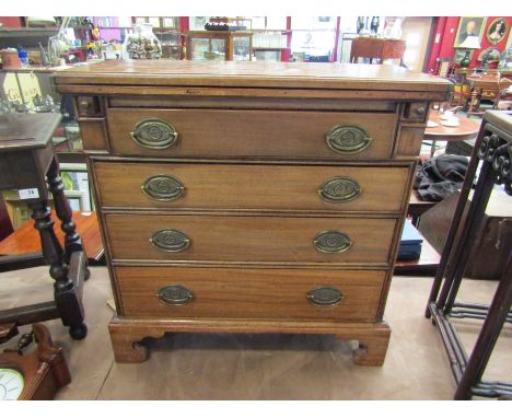 An 18th Century mahogany diminutive secretaire chest, the fold-over top over four graduating drawers set with oval brass hand