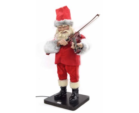 Novelty electric automata modelled as Father Christmas playing the violin, also with a change of head and outfit, upon a plin