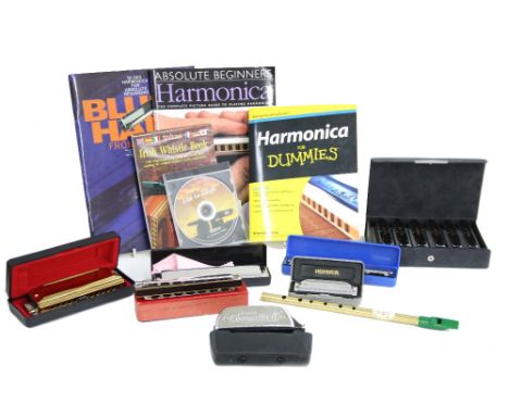 Small collection of harmonicas, to include a good Suzuki Bluesmaster Diatonic harmonica set and various others; also three in