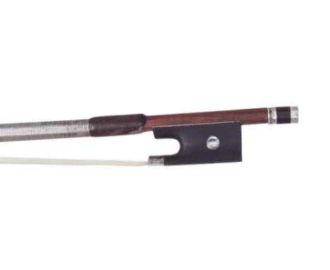 Good silver mounted violin bow, unstamped, the stick round, the ebony frog inlaid with pearl eyes and the ebony adjuster with