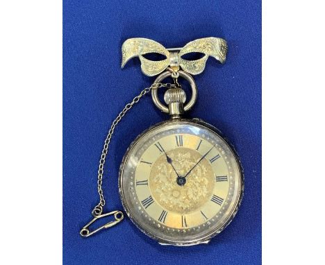 ANTIQUE 18CT GOLD CASED LADY'S FOB WATCH - with 9ct gold bow bar, the case back and rim foliate engraved with vacant cartouch