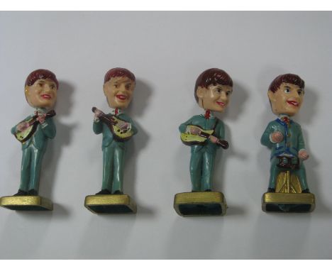 The Beatles: Four 1960's Japanese Plastic Beatles Figures, each with bobbin heads and hand painted in colours (possibly cake 