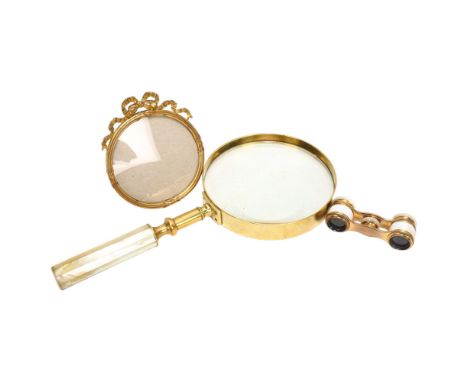 Pair of 19th century mother-of-pearl enamel and gilt-metal opera glasses, width 8.5cm, a brass-framed magnifying glass with m