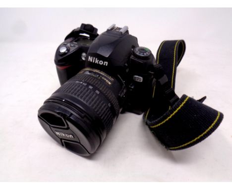 A Nikon D70 camera with lens 