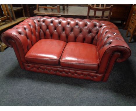 A Chesterfield button leather two seater settee 