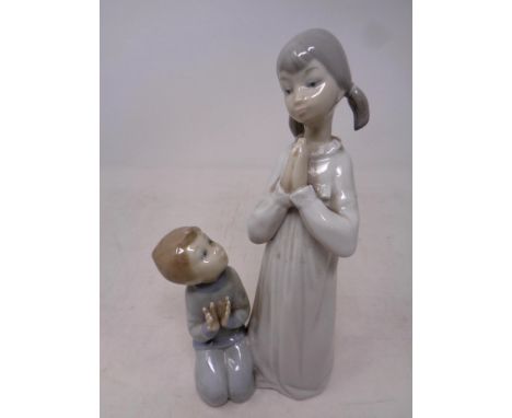 A Lladro figure, Teaching to pray  