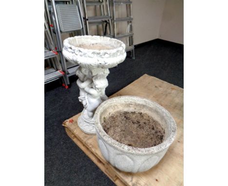 A concrete cherub bird bath together with a concrete planter  