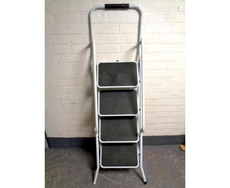 A four tread folding stepladder with handrail  