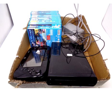 A Nintendo Wii U console and hand held device together with thirteen assorted Wii U games to include Mario Kart, Call of Duty